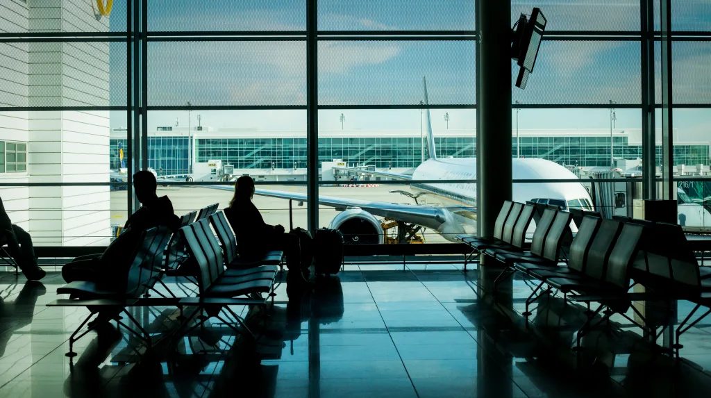 Passengers sitting in an airport terminal