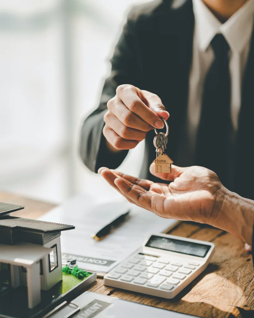 real estate agent Delivering keys and model homes to customers and home insurance contracts; home mortgage loan concepts